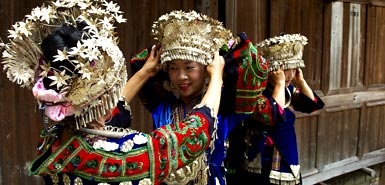 Miao girls in traditional costume and silver hairdress